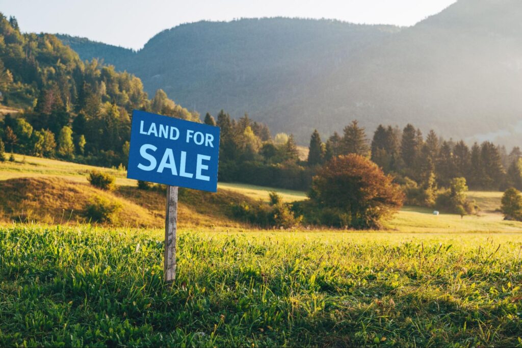 Vacant land for sale sign in a high-growth area