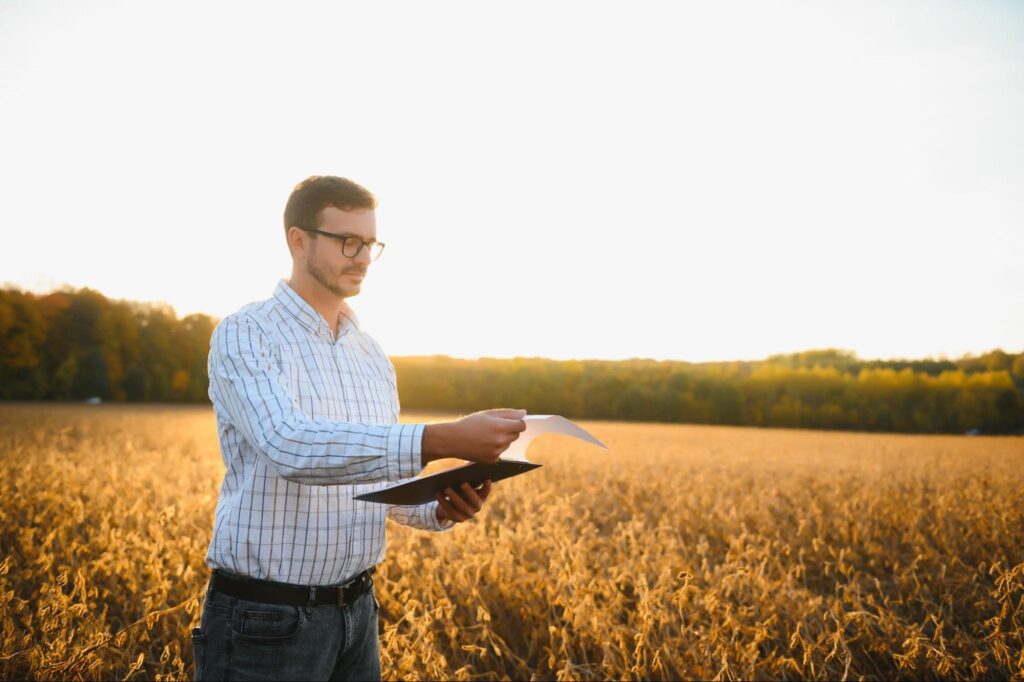 Landowner reviewing land documents and property map